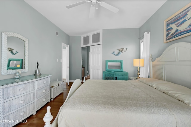 bedroom featuring ceiling fan and dark hardwood / wood-style floors