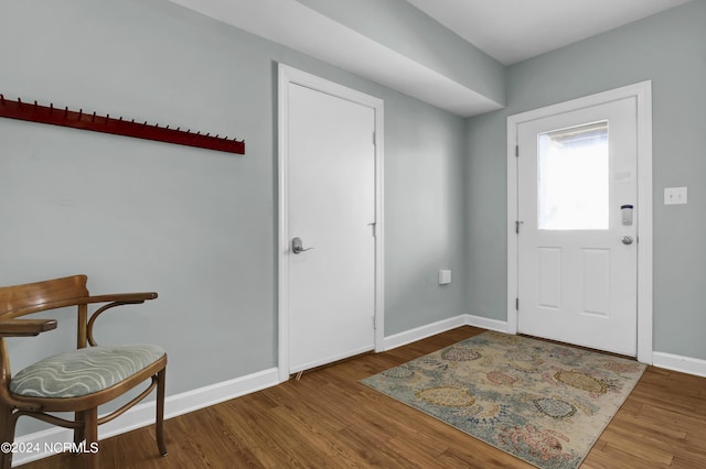 entrance foyer with wood finished floors and baseboards