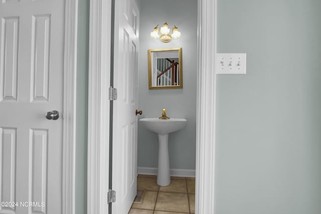 bathroom with tile patterned flooring, visible vents, and baseboards