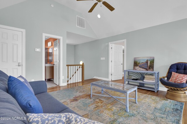 living room featuring high vaulted ceiling, wood-type flooring, and ceiling fan