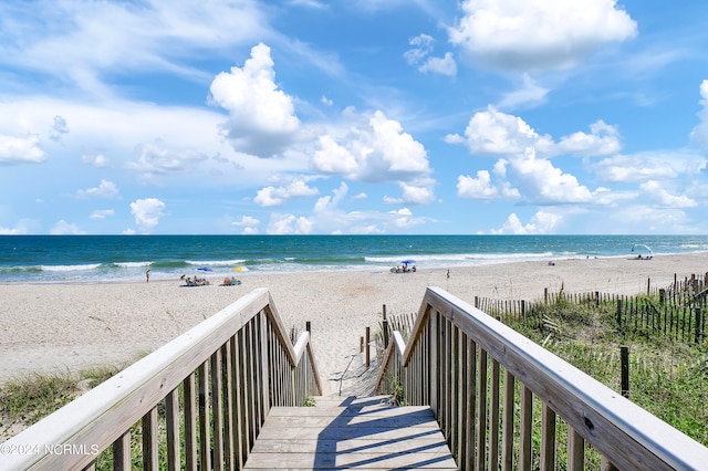 property view of water featuring a beach view