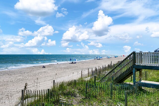 property view of water featuring a beach view