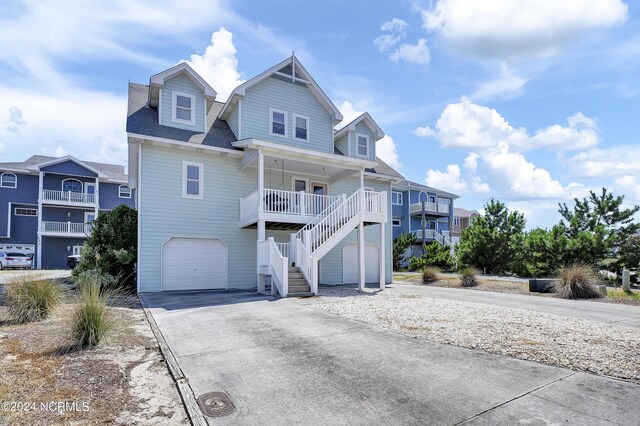 view of front facade featuring a garage and covered porch