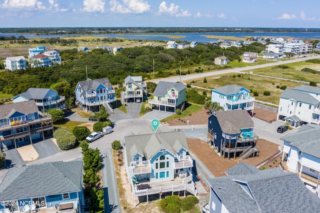 bird's eye view featuring a water view and a residential view