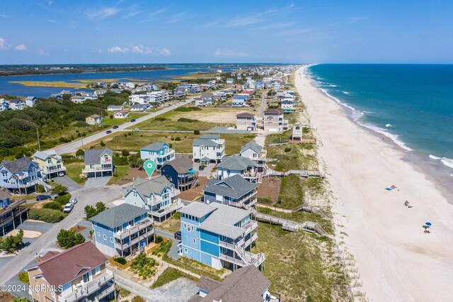 aerial view featuring a water view and a beach view