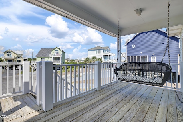 wooden deck featuring a residential view