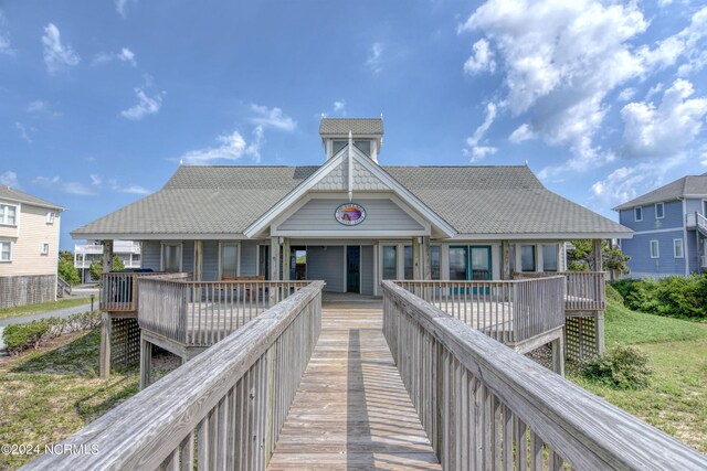 back of property featuring a wooden deck