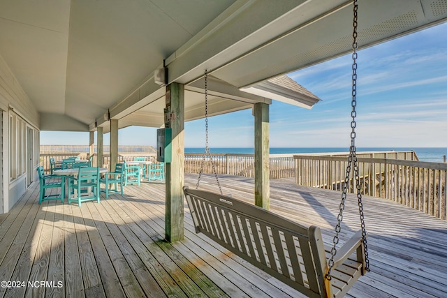 wooden deck with a water view