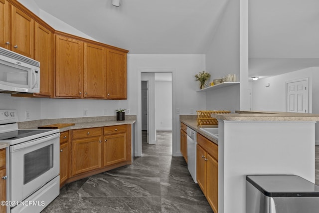 kitchen featuring white appliances and lofted ceiling