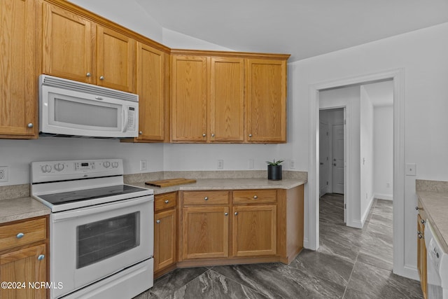 kitchen with vaulted ceiling and white appliances