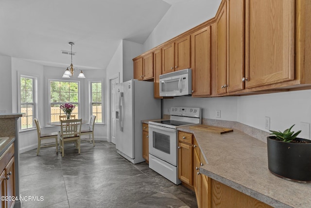 kitchen with a notable chandelier, hanging light fixtures, vaulted ceiling, and white appliances