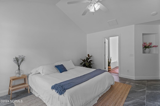 bedroom featuring connected bathroom, vaulted ceiling, and ceiling fan