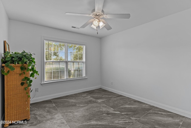 spare room featuring ceiling fan