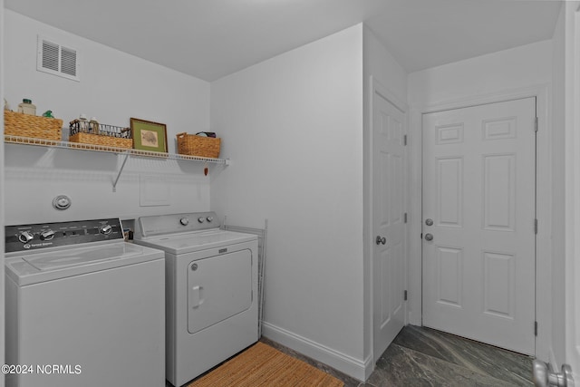 laundry room featuring separate washer and dryer