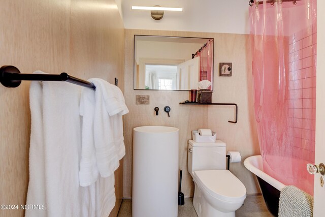 bathroom with toilet and shower / bath combination with curtain