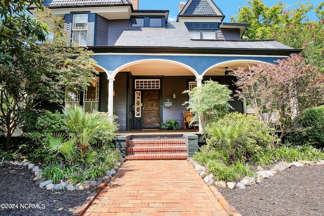 view of exterior entry featuring a porch