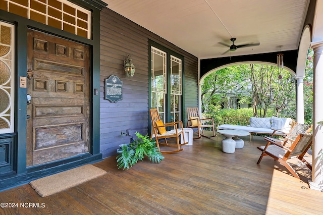 deck with a porch and ceiling fan