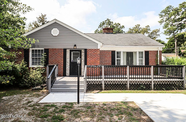 view of front of property featuring a deck