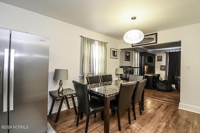 dining area featuring wood finished floors and baseboards