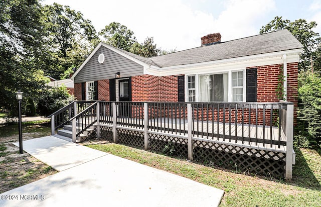 view of front of house featuring a deck