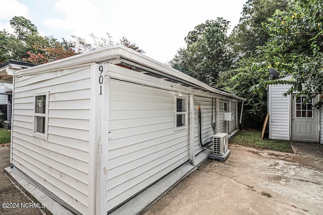 exterior space with a patio area and a storage shed