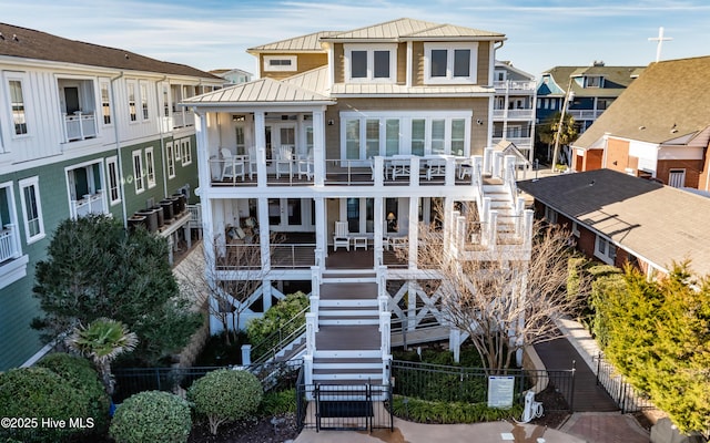 rear view of house featuring a balcony