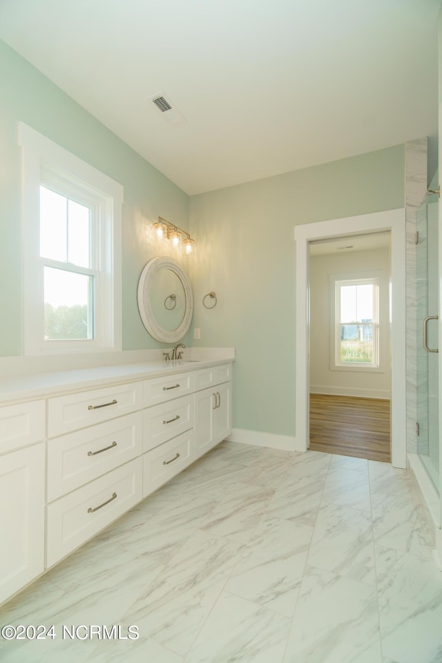 bathroom with vanity and an enclosed shower