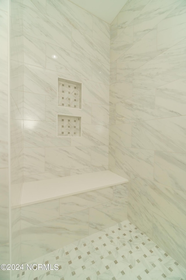 interior space featuring tiled shower