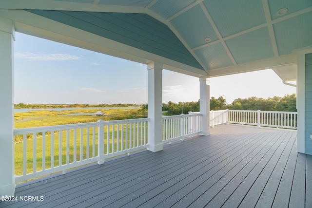 wooden deck featuring a lawn and a gazebo