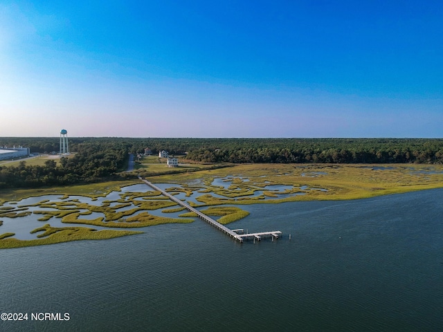 aerial view at dusk with a water view