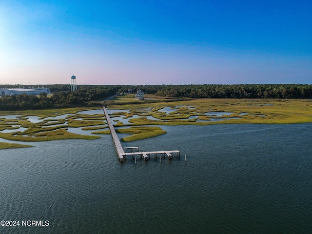 aerial view at dusk with a water view