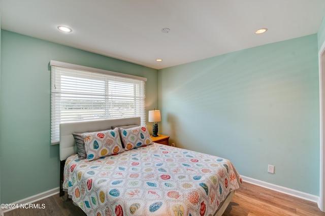 bedroom featuring hardwood / wood-style floors