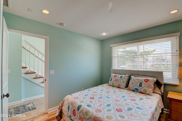 bedroom featuring hardwood / wood-style floors