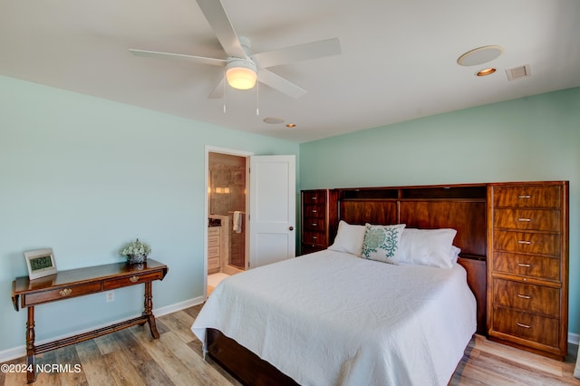 bedroom featuring ceiling fan, ensuite bath, and light hardwood / wood-style floors