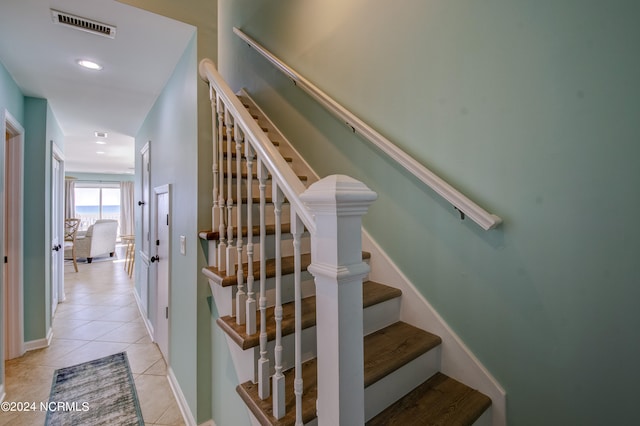 stairs with tile patterned flooring