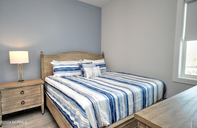 bedroom with light wood-type flooring