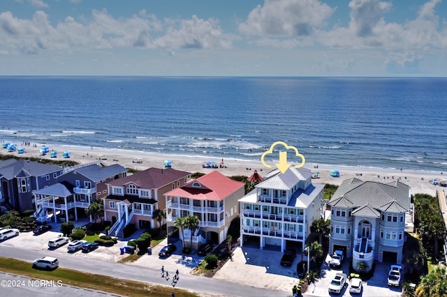 aerial view featuring a residential view, a view of the beach, and a water view