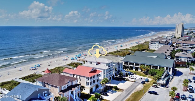 aerial view featuring a view of the beach and a water view