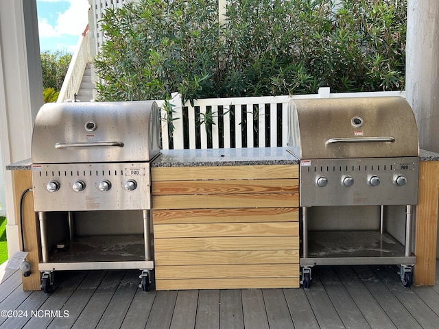 wooden terrace with area for grilling