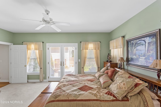 carpeted bedroom featuring ceiling fan, access to outside, and french doors