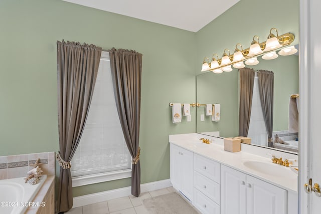 bathroom with vanity, tile patterned floors, and a washtub