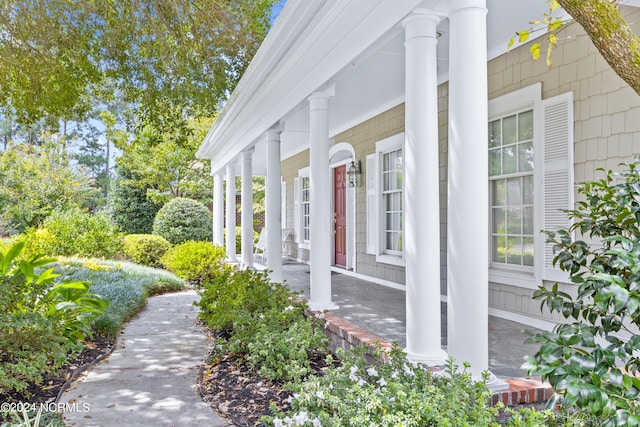 view of property exterior with a porch