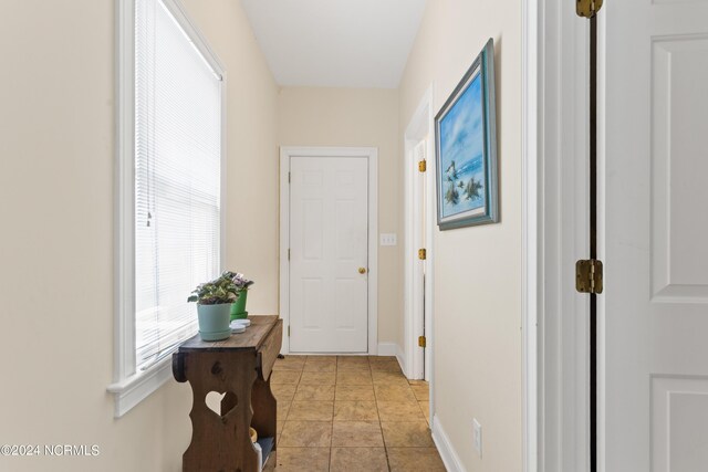 hallway with light tile patterned flooring