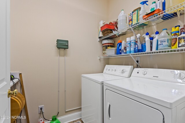 washroom with independent washer and dryer