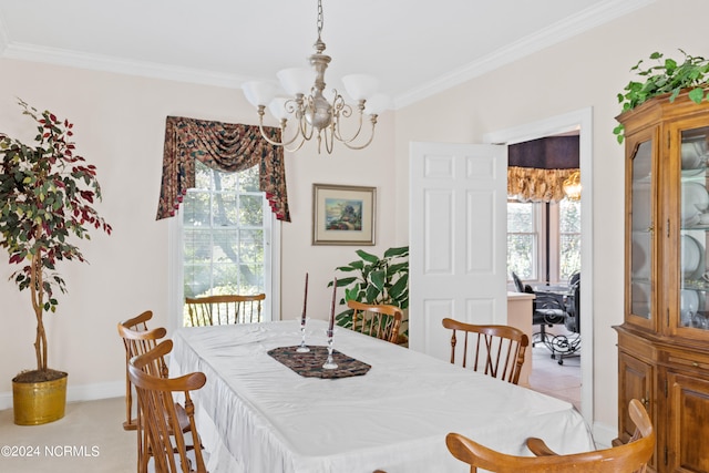 carpeted dining room with crown molding and a chandelier