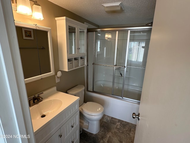 full bathroom with vanity, toilet, a textured ceiling, and enclosed tub / shower combo