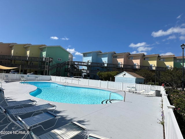 view of swimming pool with a patio