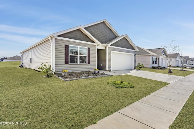 view of front of property with a garage and a front yard