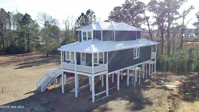 view of front of house with a sunroom