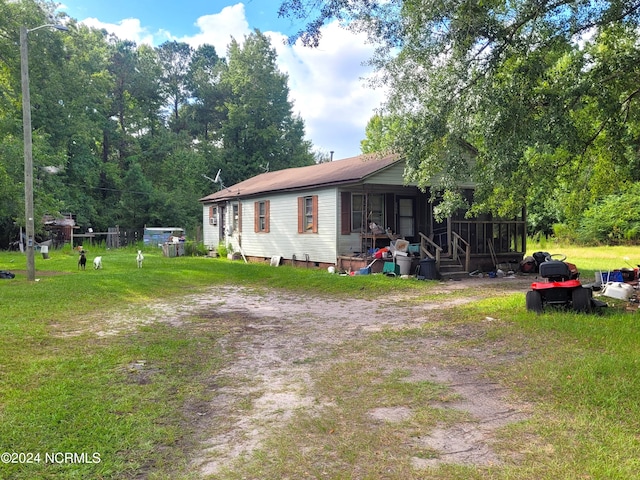 exterior space featuring crawl space and a yard